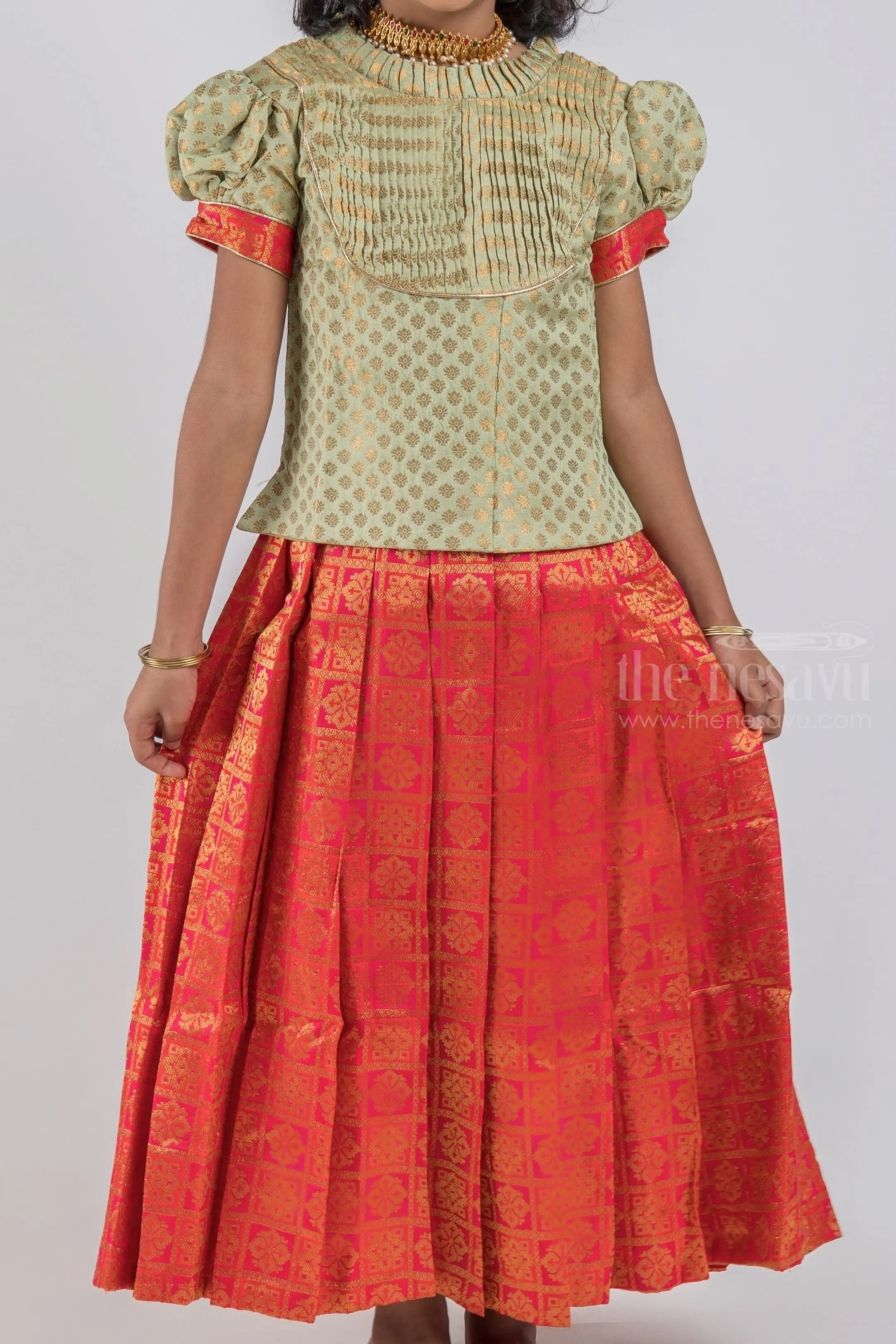 Pretty Lite Green Floral Designer Blouse And Orange Pleated Designer Silk Skirt For Girls